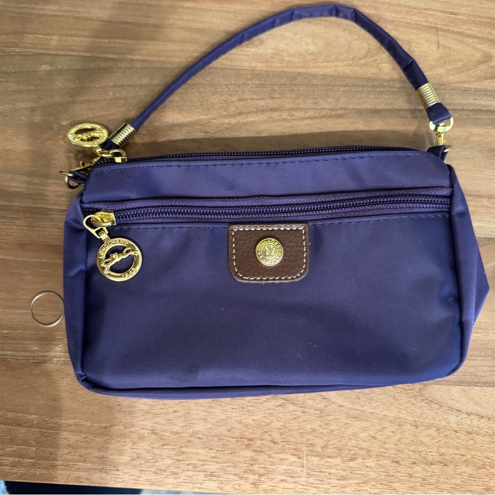 Longchamp purple wristlet with gold hardware